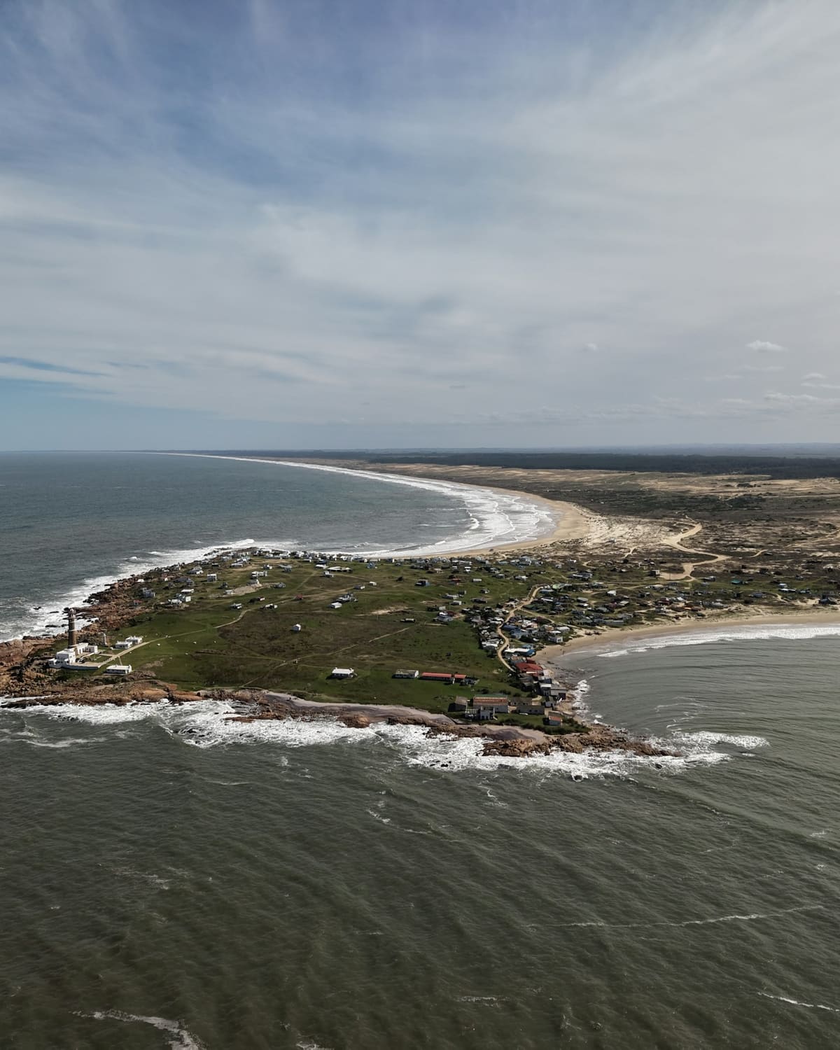 Cabo Polonio from the air: the headland with the village, the beach behind it