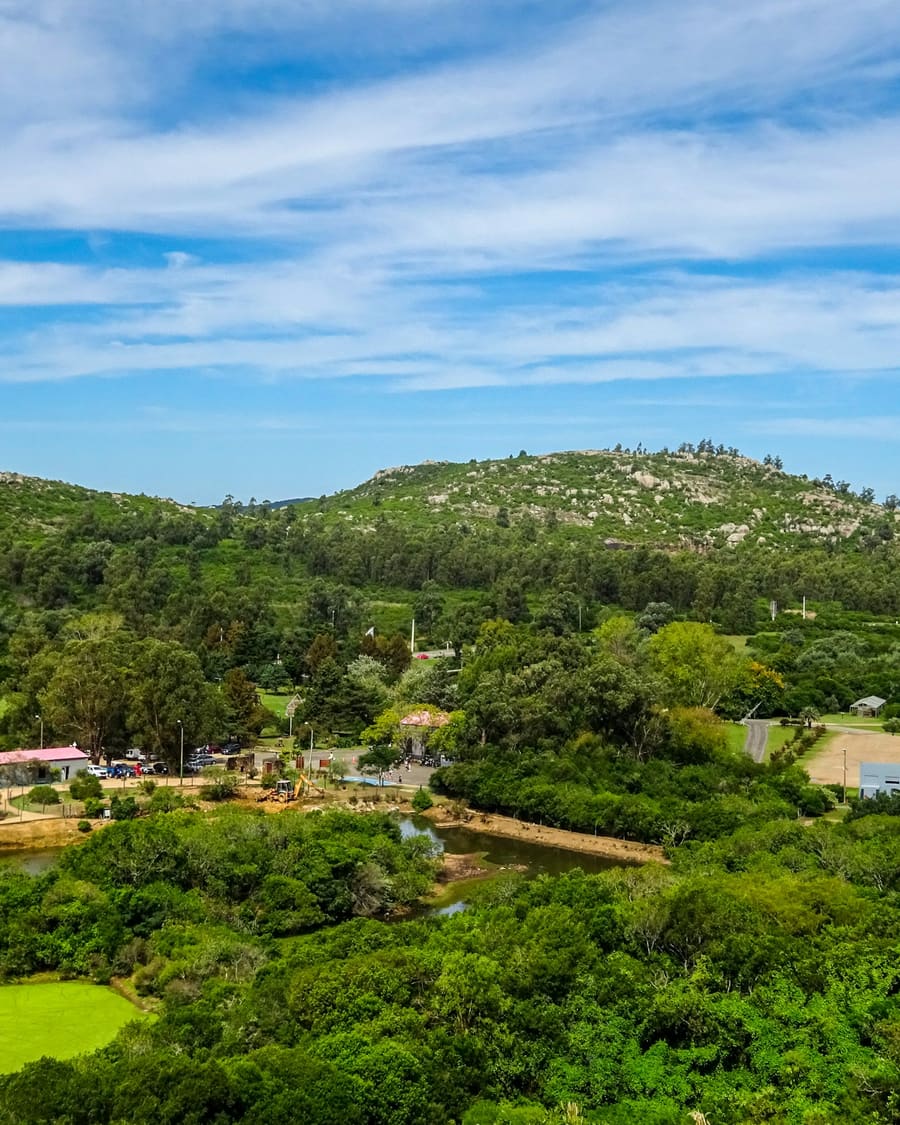 Green hills near Piriápolis with trees and a few houses below