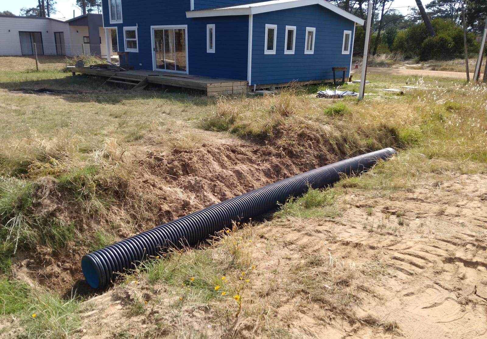 Drainage pipe in the freshly dug trench, with Casa Azul behind it.
