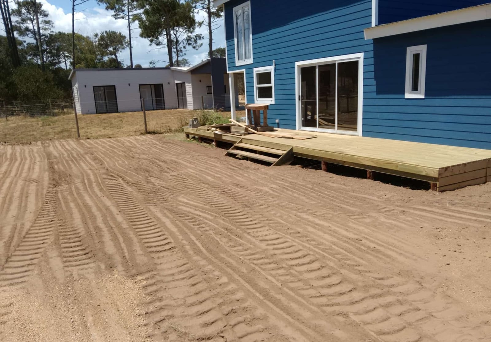 Casa Azul with the new timber terrace, levelled sandy ground.