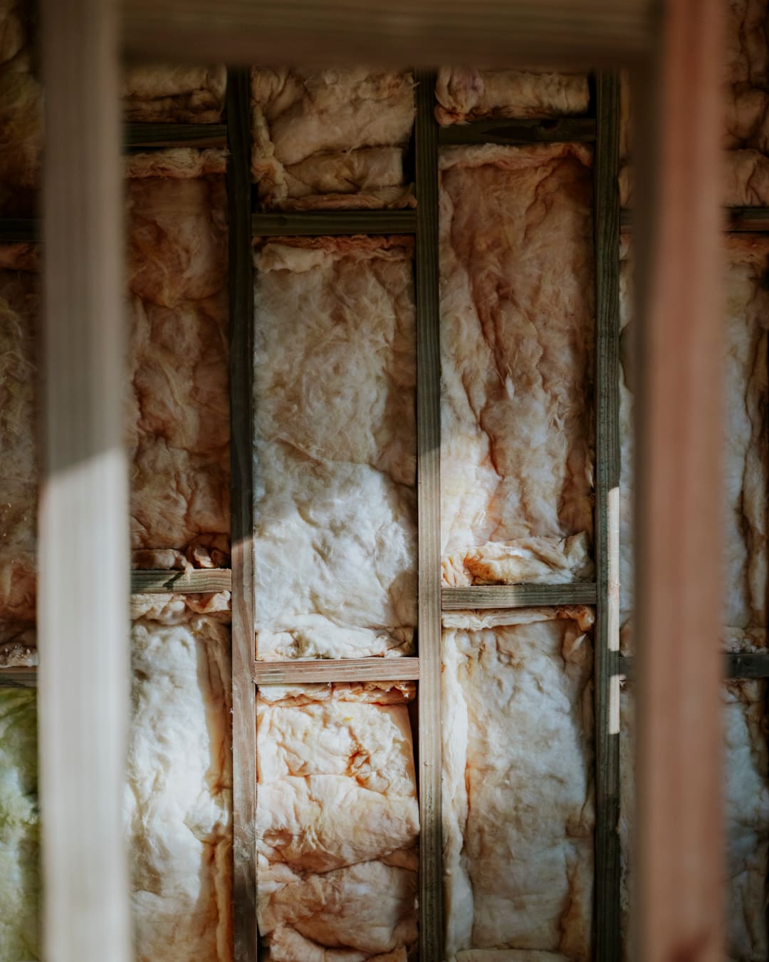 Mineral wool between timber studs, close up.